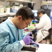 Inventor Kris Ylaya Reviewing Prototype 