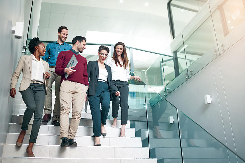Young professionals walking down a staircase 