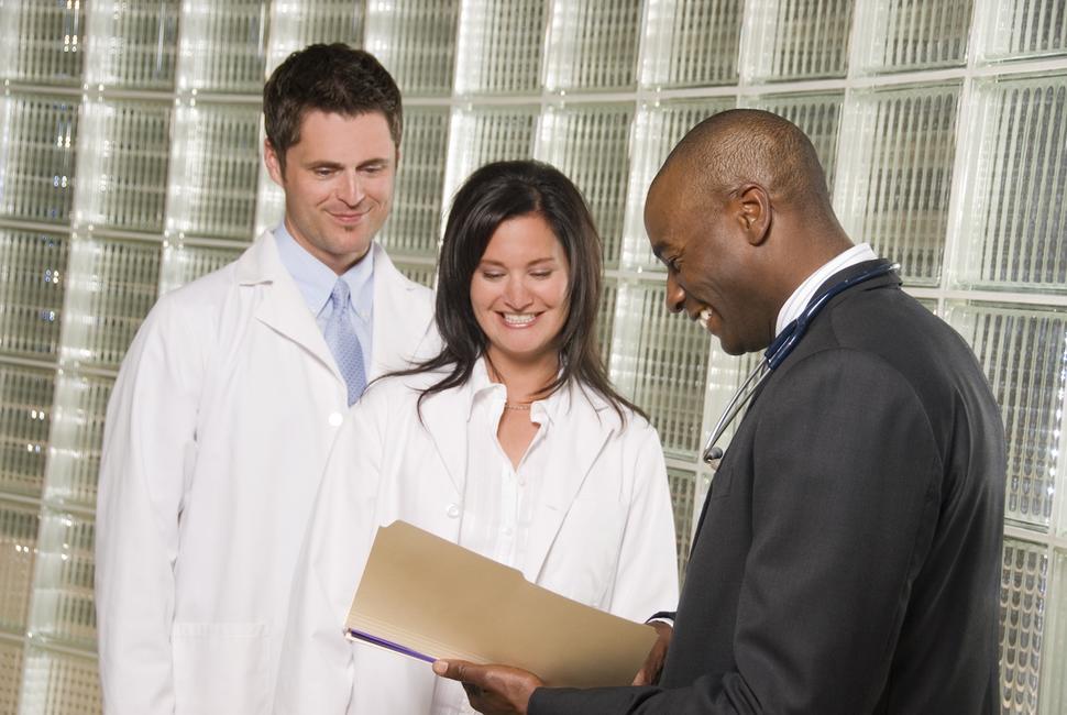 researchers and business people review document research business SBIR