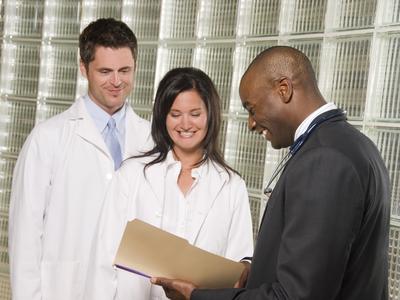 researchers and business people review document research business SBIR